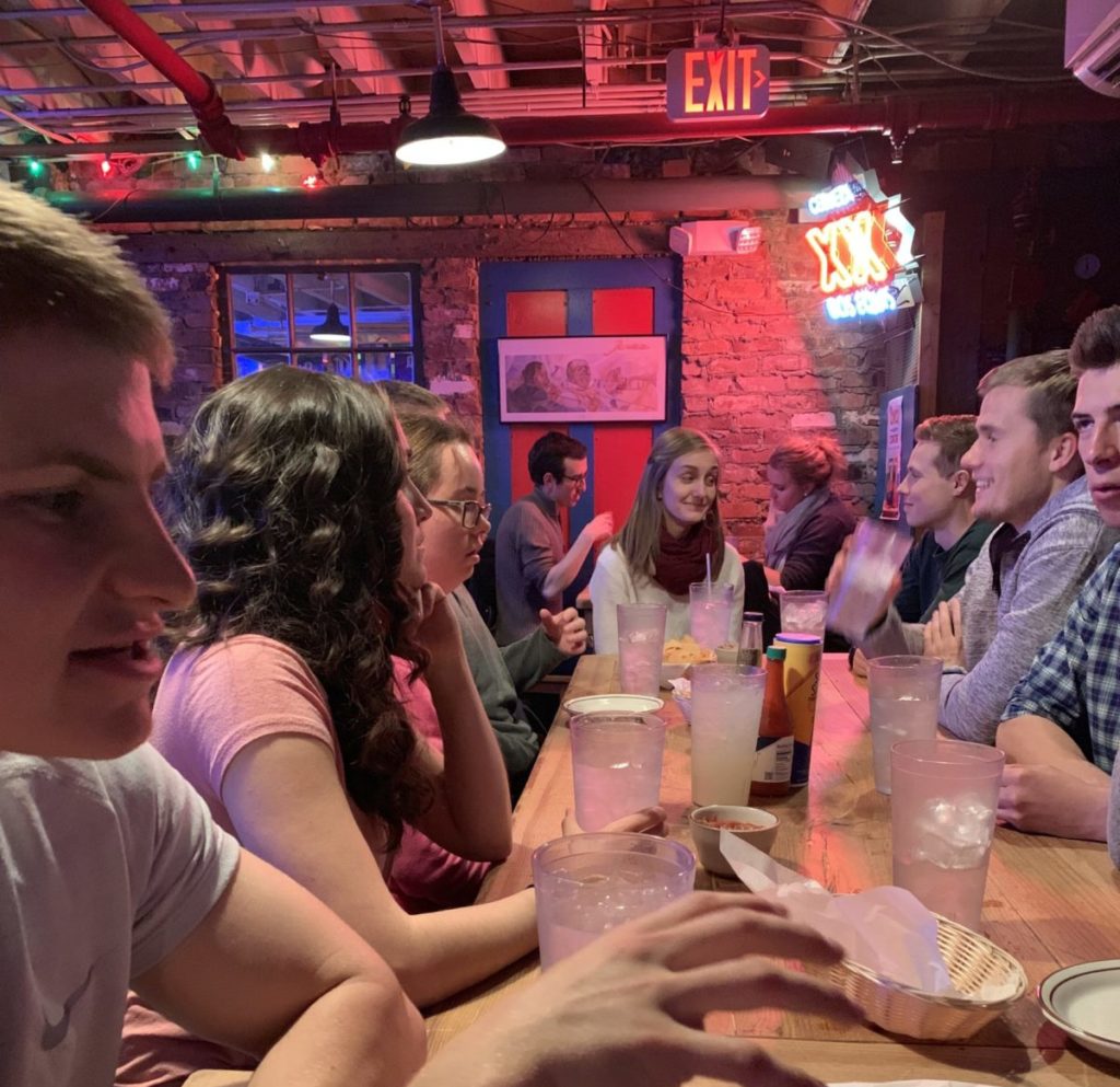 People socializing in the evening.