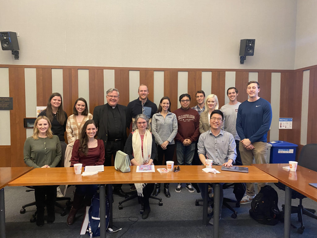 Group posing in a classroom. 