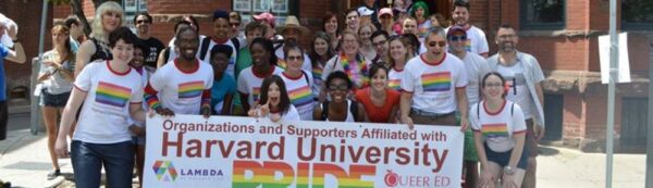LAMBDA members with Pride banner. 