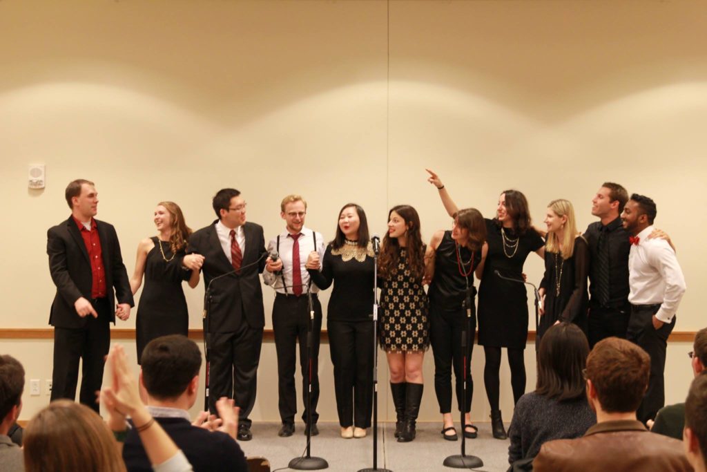 People singing on stage. 