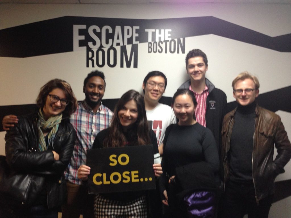 Scales members at escape room. 