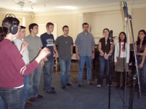 People singing in studio. 