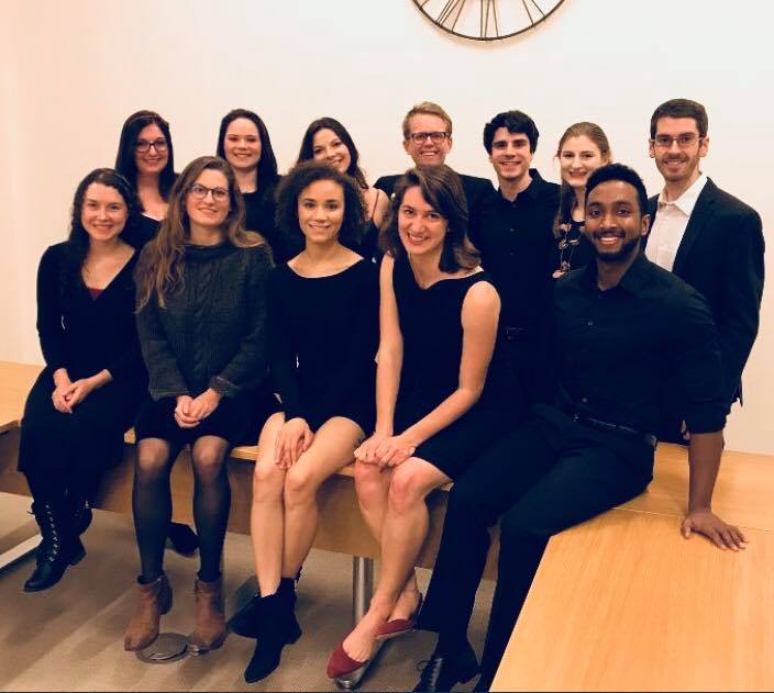 Scales members seated. 